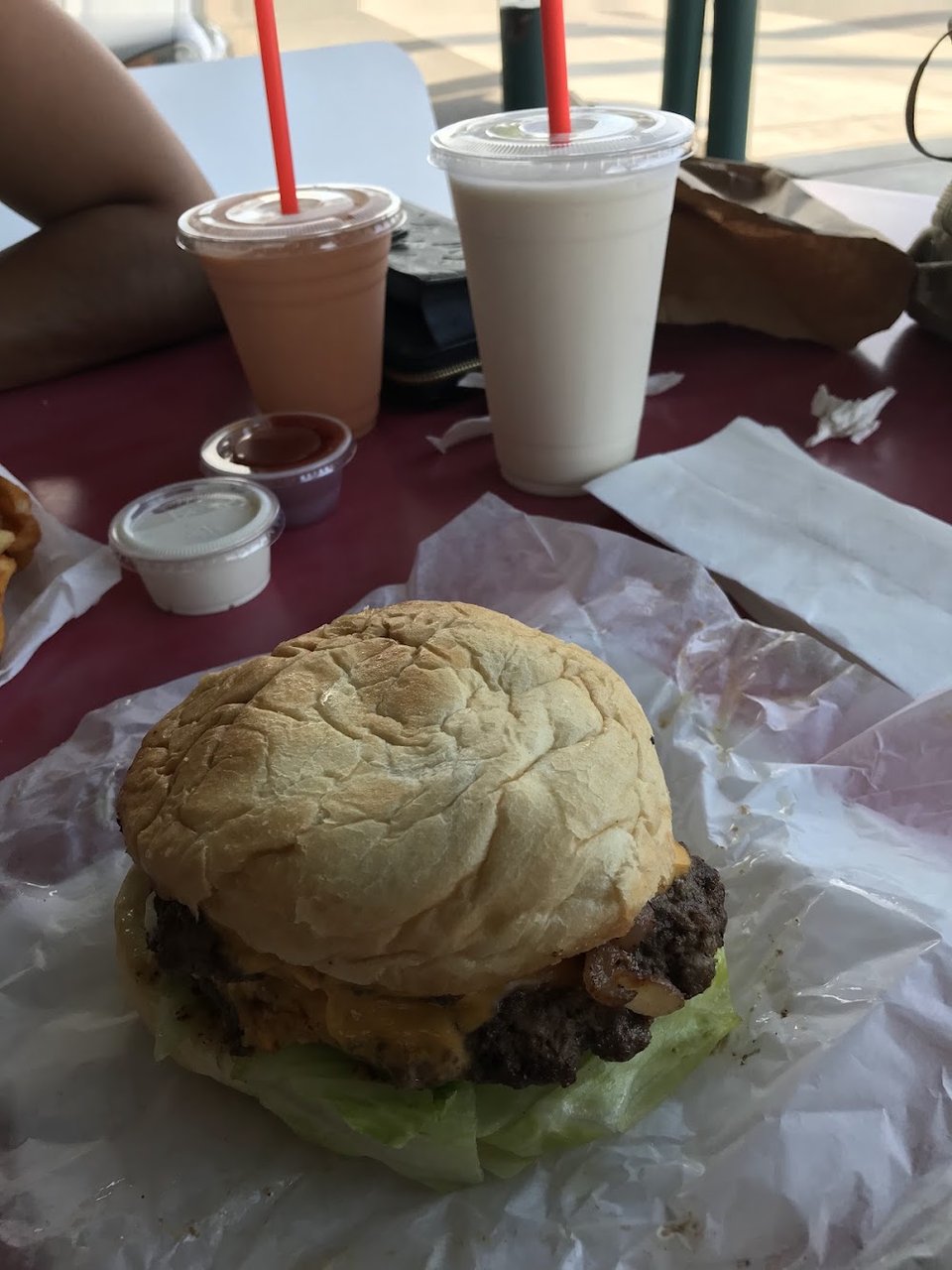 Counter menu with hamburgers and onion rings.