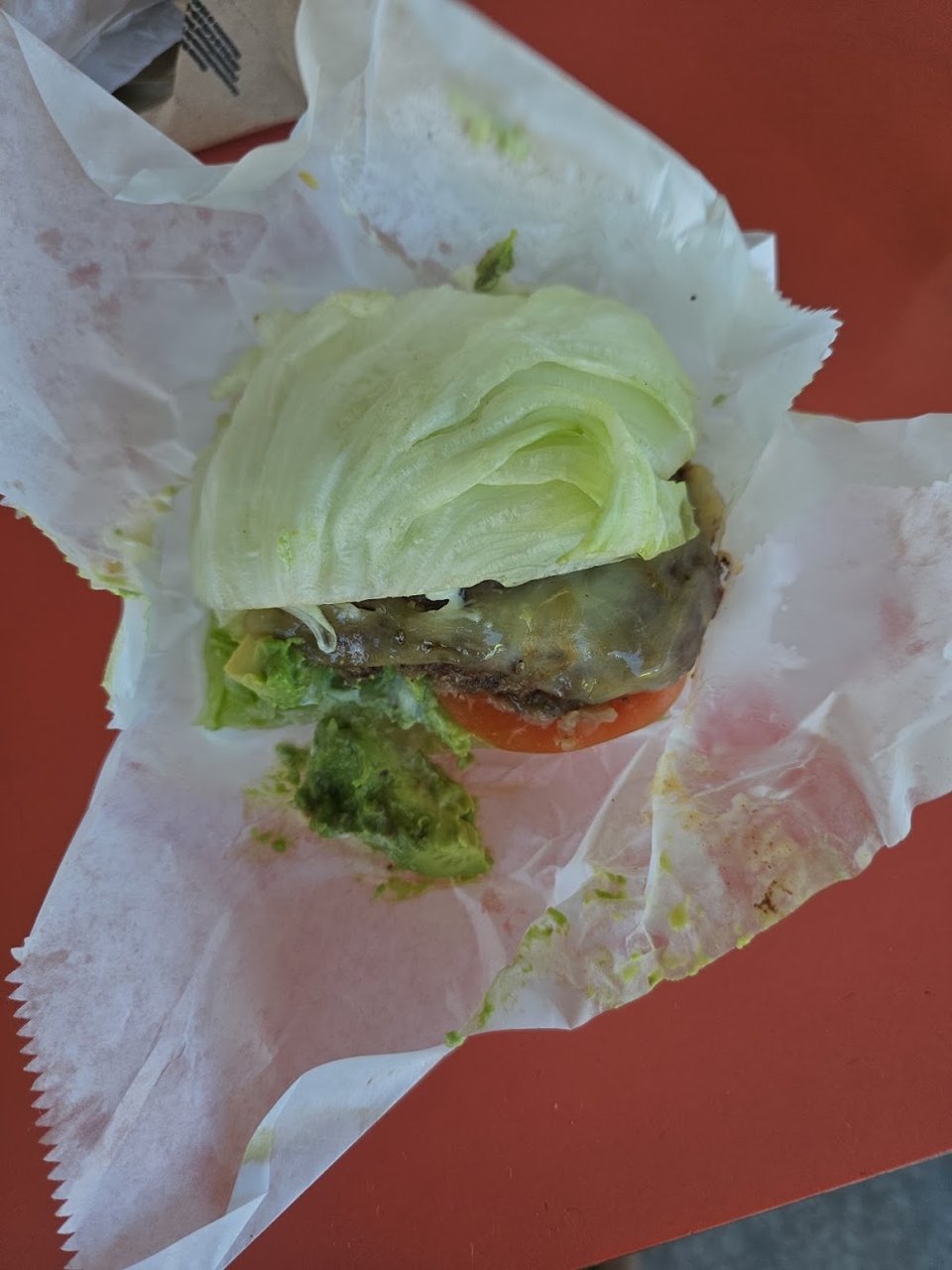 Counter menu with hamburgers and onion rings.